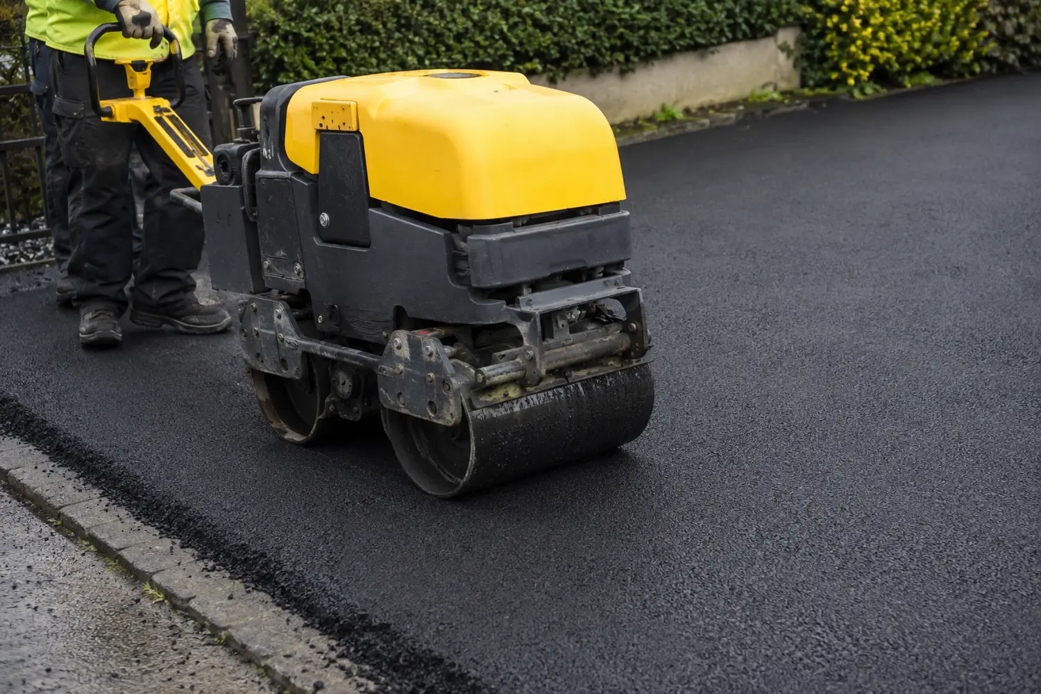 Rolling a newly laid tarmac surface