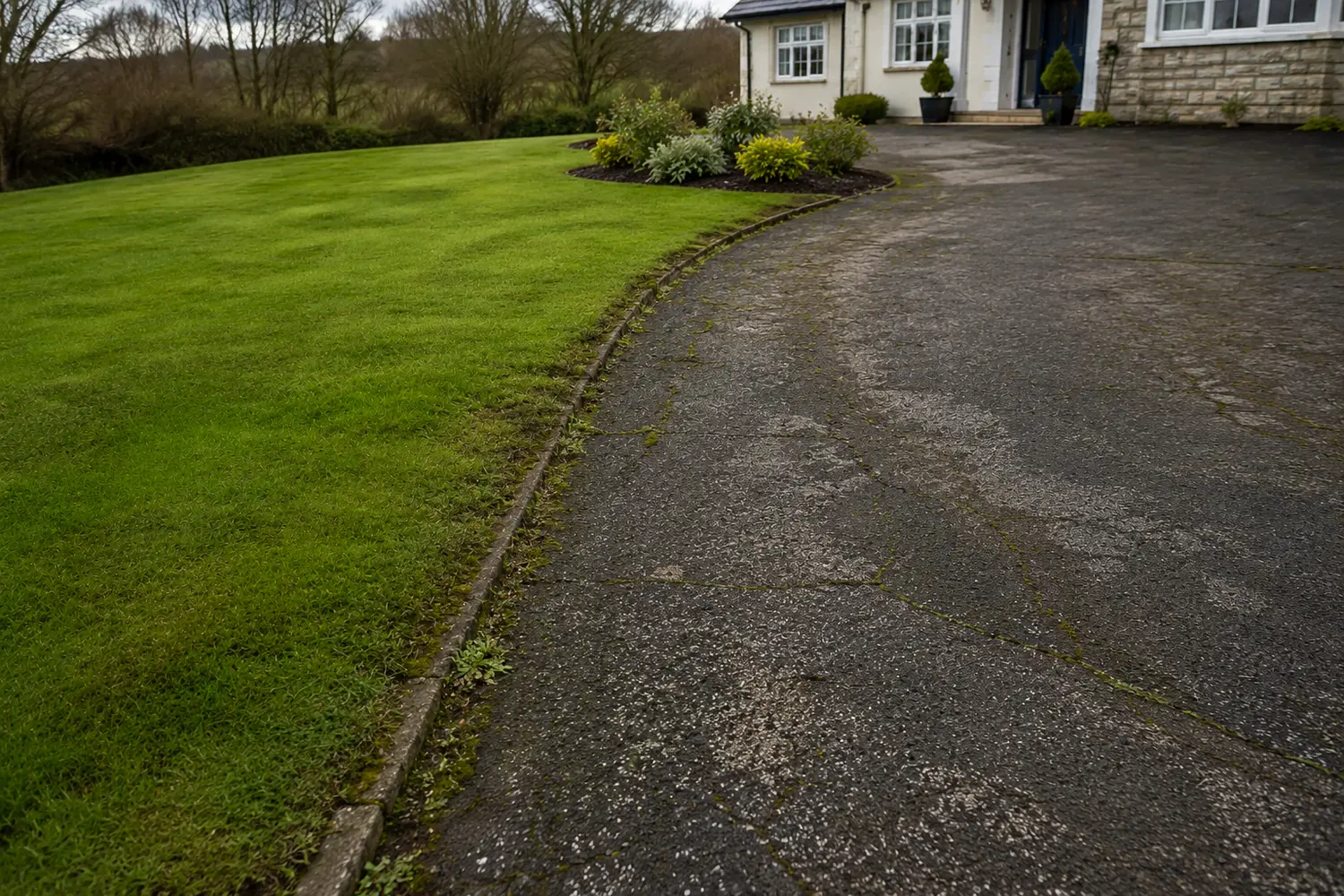 A cracked, tired surface before tarmac resurfacing